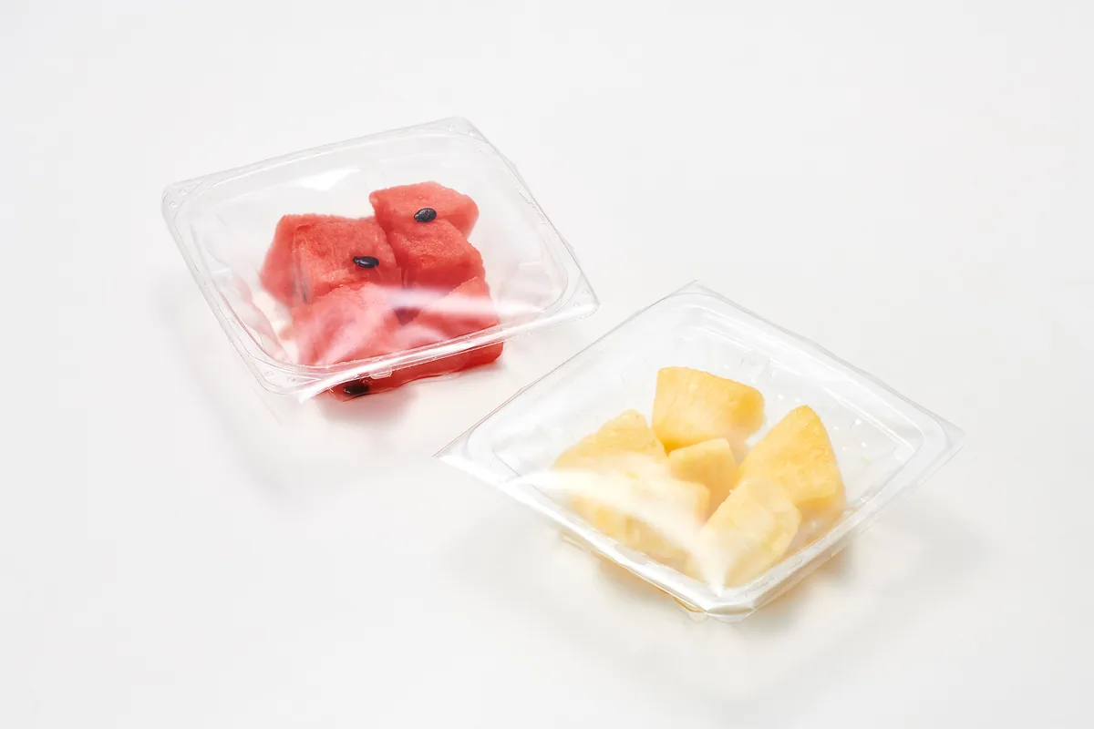 Cut fruit in a film-sealed clear container