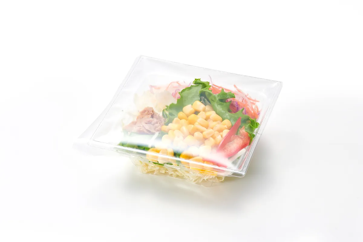 Chilled side dish in a film-sealed clear container