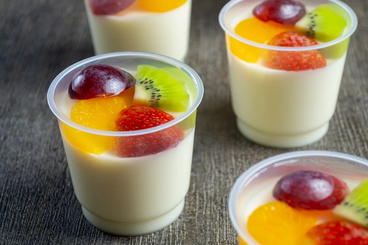 Dessert cups topped with fruit